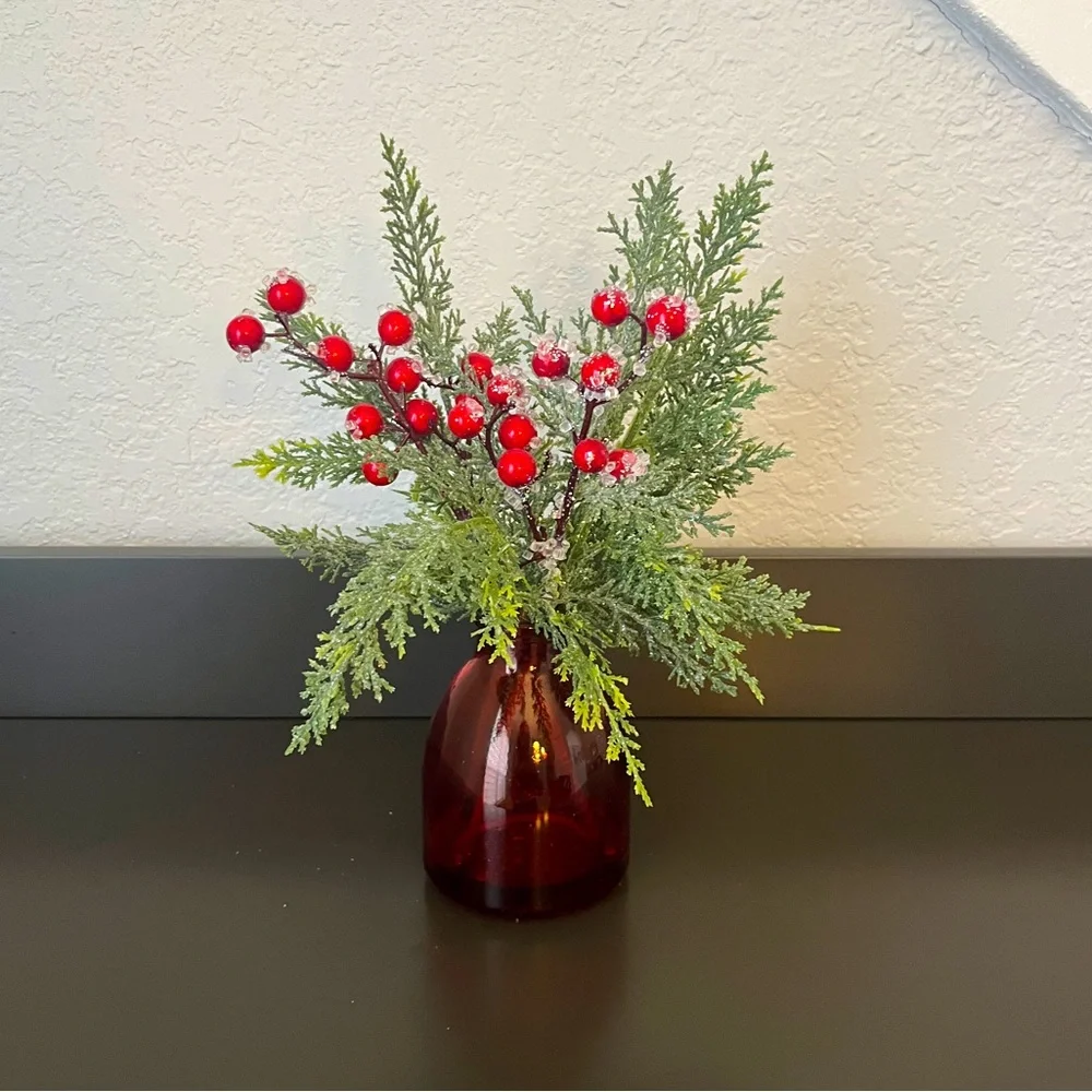Pine and berry christmas branches in red vase/ Christmas floral arrangement